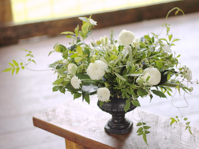 Suzy and joe's wedding was the perfect opportunity to design with locally grown flowers from Detroit farms like Fresh Cut flower farm and Ann arbors Seeley farms.  These have got to be some of my all time favorite centerpieces and bouquets with lush textured foliages including home grown jasmine vine, wild blueberry, variegated pittospurmum, rosemary, explosion grass camellia, ferns, and olive branches,  The giant poppy pods gave each piece its focal point and the wild scabiosa and ranunculus prettied it all up.  sweet pea floral design ann arbor detroit black stone urn compote garden centerpiece jammable garden vase.