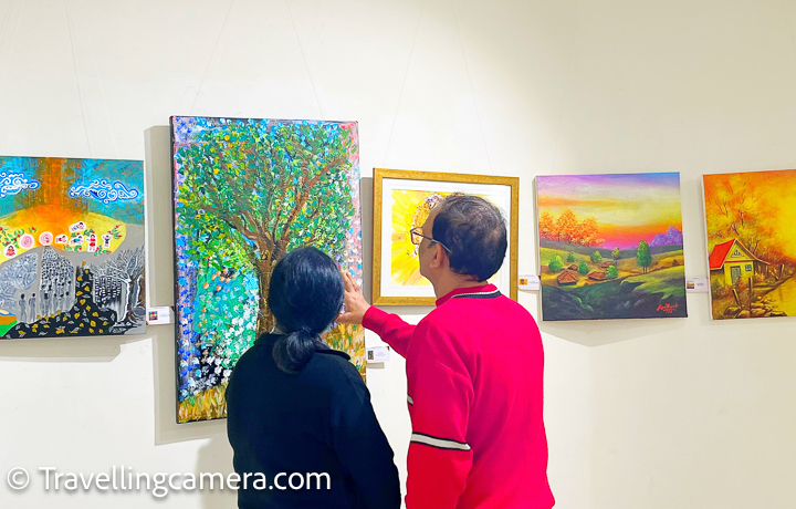 Visitors at Lokayata Art Gallery looking at the art by Dr Bharati Malhotra.