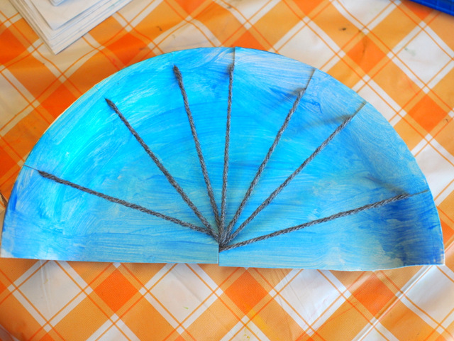 Weave a rainbow! Fun Rainbow Paper Plate Weaving Art and Craft Project for kids