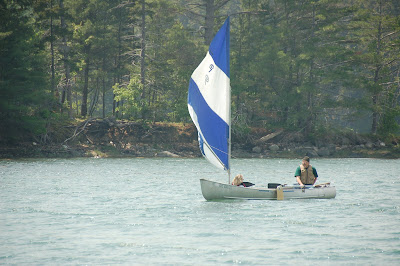canoe sail kit from sailboatstogo.com flies across lake
