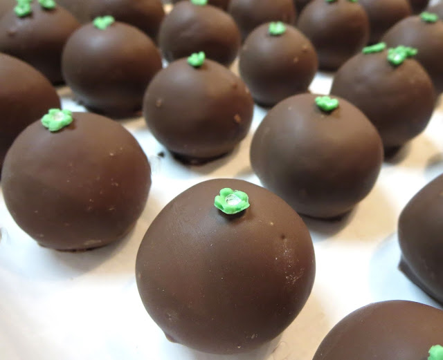 Chocolate Cake Balls with Tiny Green Flowers - Close Up Angled View 1 Flower