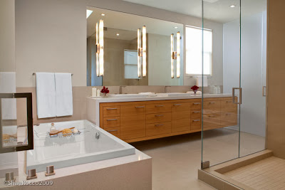 minimalist bathroom in white and light hues furnished with big mirrors to open up the space