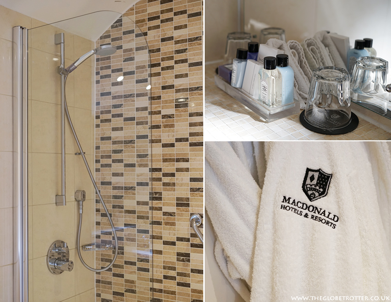 Bathroom stocked with luxury bathrobes and toiletries at the Macdonald Bear Hotel