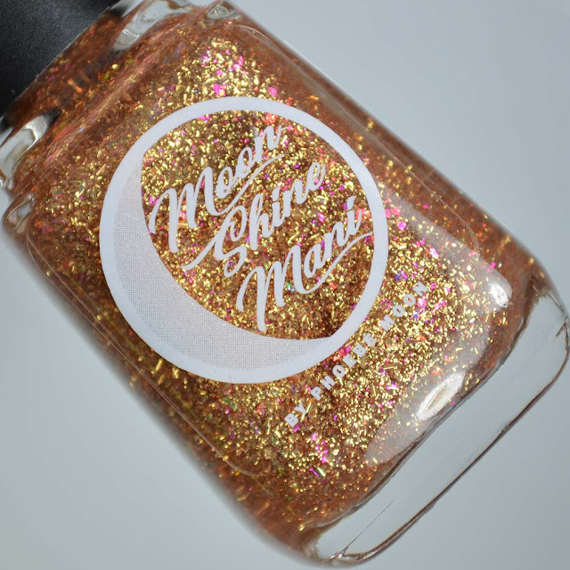 gold flakie nail polish topper in a bottle