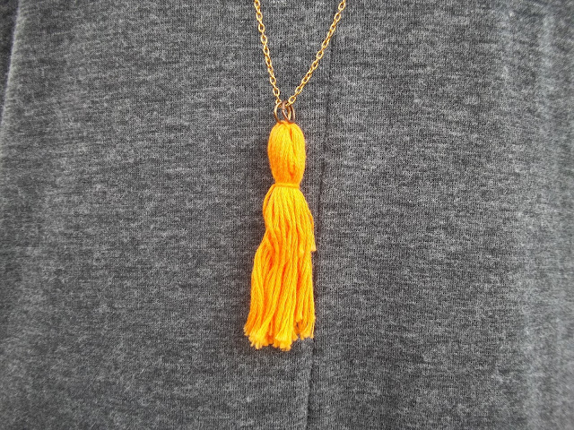 grey knit cocoon dress orange tassel necklace simple necklace filigree black ankle booties outfit dressember dress donate human trafficking