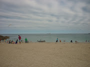 One of those timeless seaside scenes: people busy having fun.