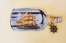 Close up of boat in a bottle stamp 