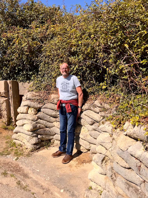 madmumof7's husband standing next to sand bags at Maisy Battery