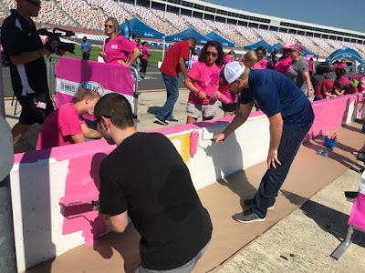 Jimmie Johnson, DeAngelo Williams and NASCAR Drivers Join Breast Cancer Survivors to Paint Pit Wall Pink