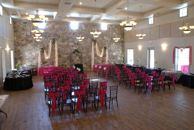 Their silk draped wedding arbor featured massive floral across the top with