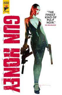 Cover for comic collection “Gun Honey” by Charles Ardai (writer), Ang Hor Kheng (artist), Asifur Rahman (colourist) and David Leach (letterer). Against a white background, a tall white woman with slicked hair in a dress with plunging neckline. She carries a gun in each hand – in her right, some kind of complicated assault weapon, in her left, a pistol with silencer.