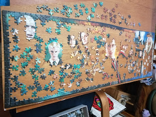 A Harry Potter jigsaw that is only a quarter complete with some of the Harry Potter characters faces semi-completed