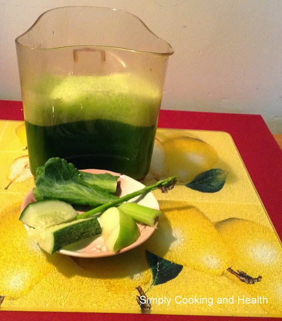 Cucumber, Kailan, asparagus, celery and apple. Slow juicer jar is in the background.