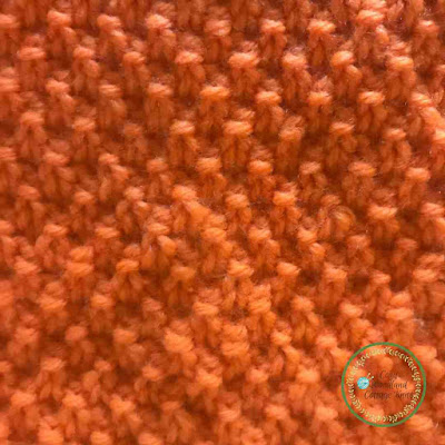 close up of moss stitch on a knitted square