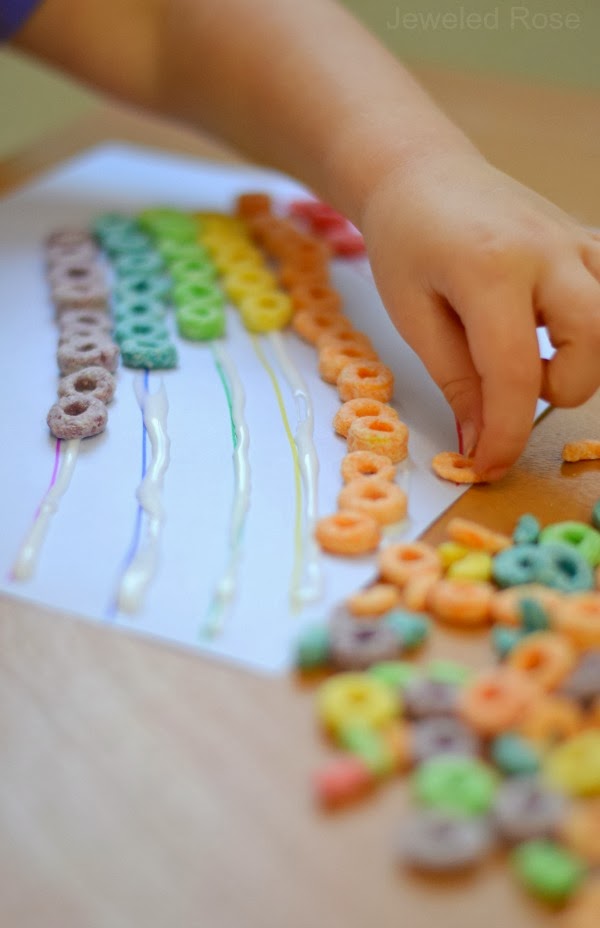 I gave Rosie and Jewel a large bowl of Fruit Loops, and they had lots of fun sorting the colors and placing them onto the rainbow lines