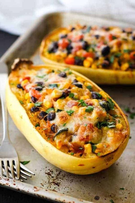 A hearty vegetarian dinner for two of roasted spaghetti squash halves stuffed with a flavorful southwestern veggie and cheese filling.