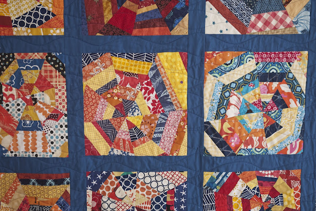 blue navy orange yellow spiderweb block quilt