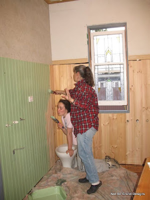  Llick and Blick painting the panelling green - the same colour as the sink.