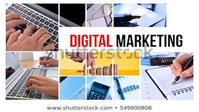 Digital marketing graphics, computers, notepads, pens and calculators.