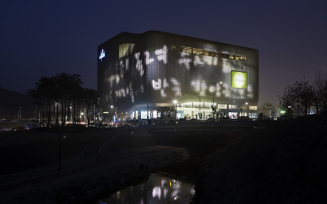 Photo of new building as seen at night with beautiful lights on facade