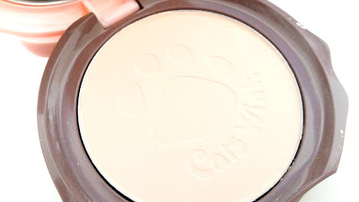 Cat paw and pact's name are pressed into the powder pact.