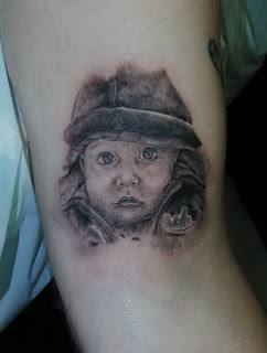 baby face tattoo