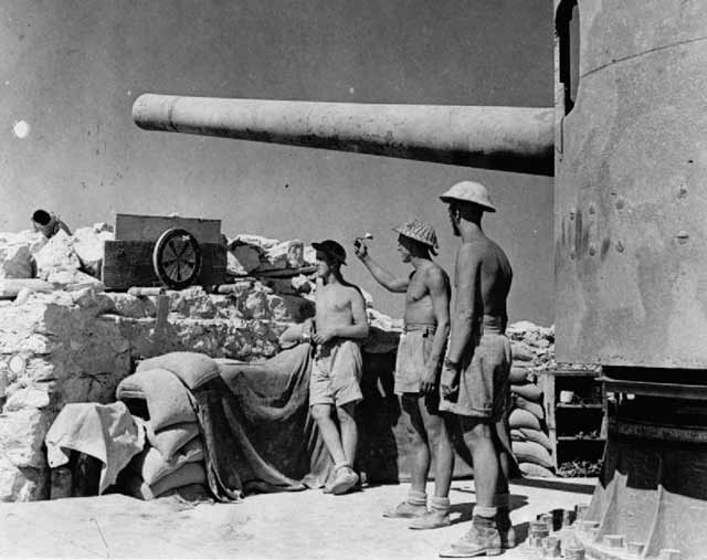 British at Tobruk under a captured Italian 149 mm gun, 1 September 1941 worldwartwo.filminspector.com