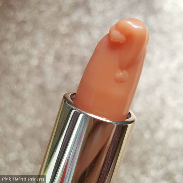close up of back of Paul & Joe Treatment Lipstick 001