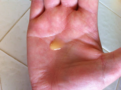 This is a picture of golden yellow Annmarie Anti-Aging Serum squirted out into my hand.