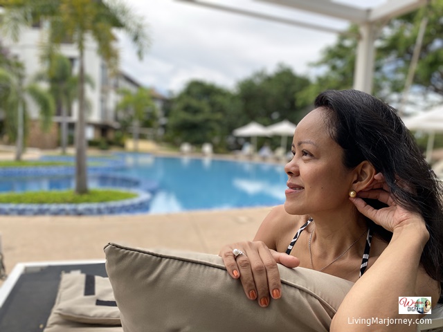 Marjorie Uy lounging by the pool