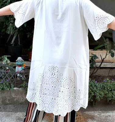 http://it.shein.com/White-Laser-Cutout-Scallop-Trim-Long-Kimono-p-308471-cat-1878.html