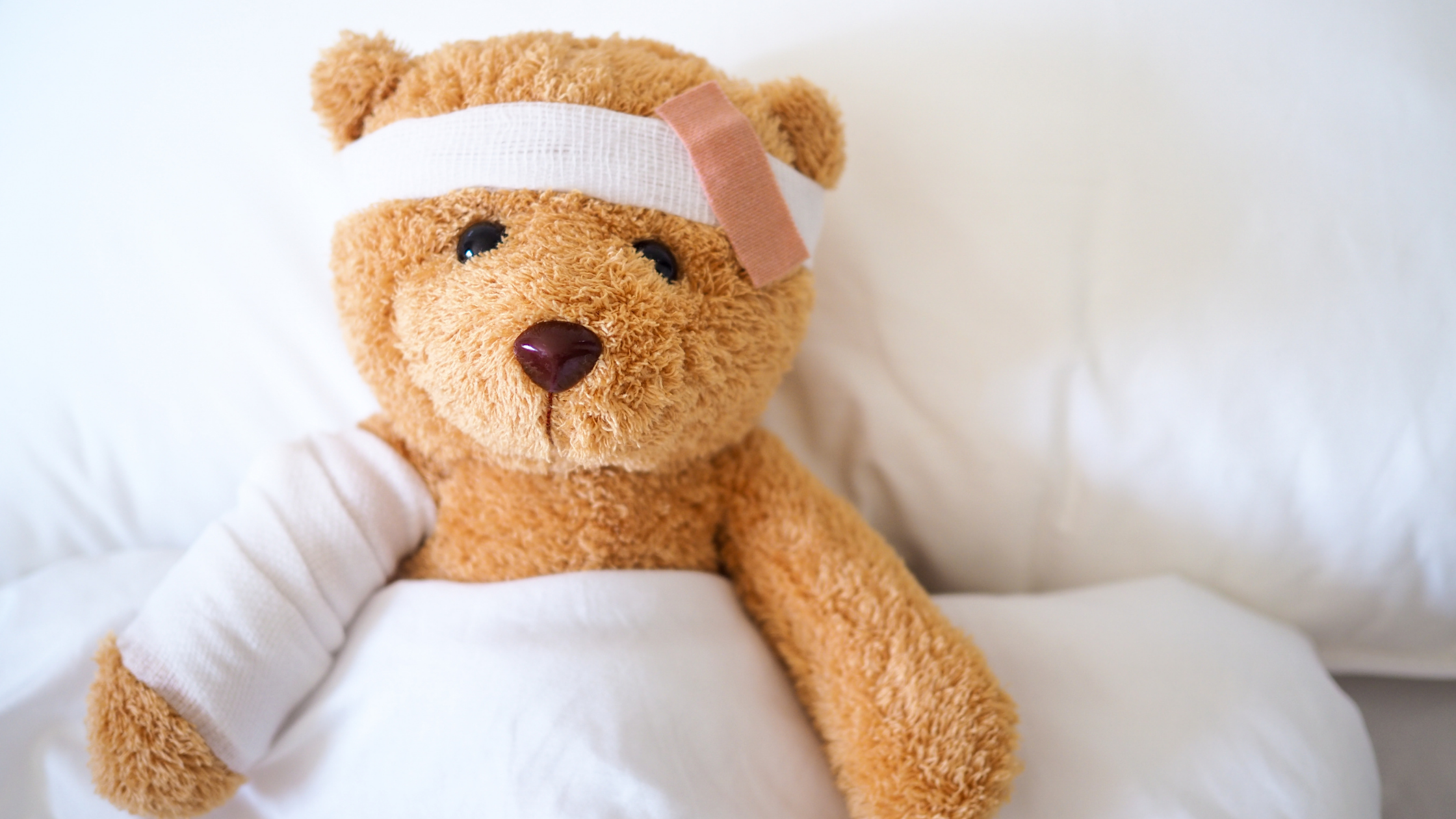 Teddy Bear in hospital bed