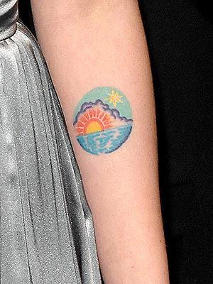 aussi flag skin rip tattoo on forearm. Scarlett Johansson Tattoo