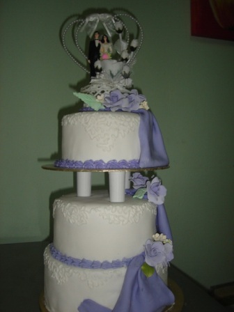 Martina 3 tier wedding cake with purple drape in conneli design and silver 