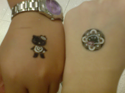 We even got Hello Kitty Tattoos~. Mine's on the right~. But it's gone le.