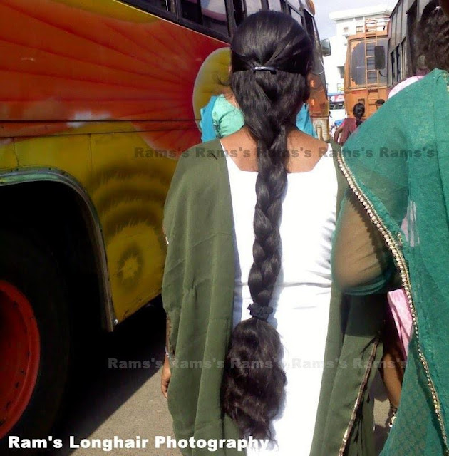 long hair college girl walking in bus stand.