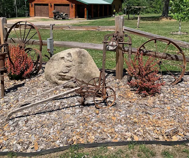 Photo of yard junk decor/split rail fence