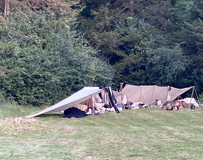 Soldiers camped at the edge of the woods during a re-enactment at Mount Independence Vermont Labor Day Weekend 2023