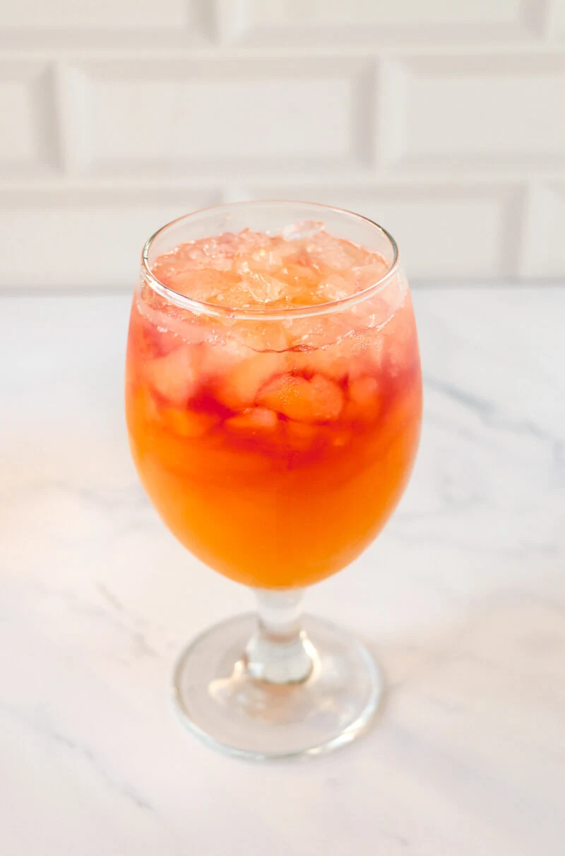 A simple glass of rum punch over ice.