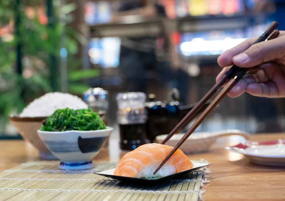 Countries With Healthiest Food, chopsticks salmon nigirizushi