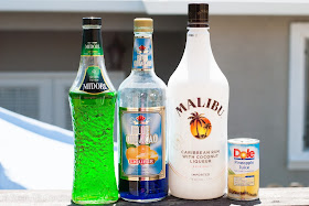 Green Tropics cocktail, coconut rum, malibu rum, pineapple juice, blue curacao, melon liqueur, midori