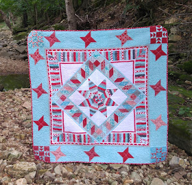 Red and aqua red robin quilt