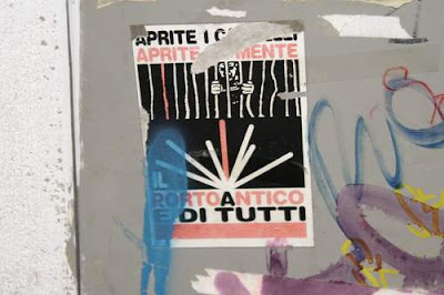 Graffiti image of a sticker of a person in gaol from the old town centre of Genoa, Italy.