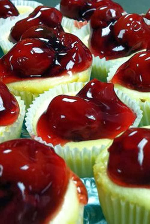 Bite-size cheesecake cupcakes with cherry toppings for your holiday parties and potlucks.