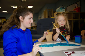 High school junior Corrinne Lombardi, of Wrentham, works with  a preschooler in the Tri-County Children’s Center