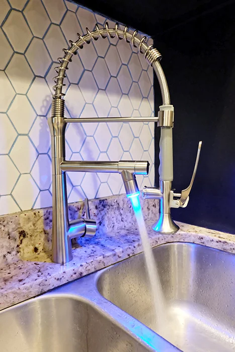 water running out of new installed kitchen faucet