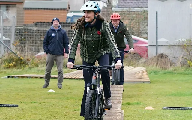 Princess of Wales wore a check diamond quilted coat by Burberry with a pair of flared jeans at Burghead Primary School