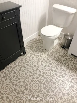 Stenciled floor in basement bathroom.