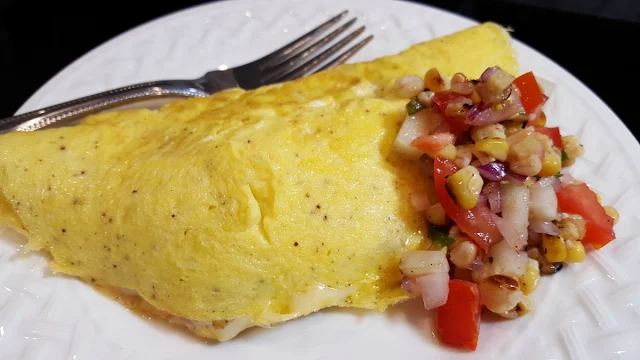 A Cheese Omelet with Grilled Corn and Tomato Relish