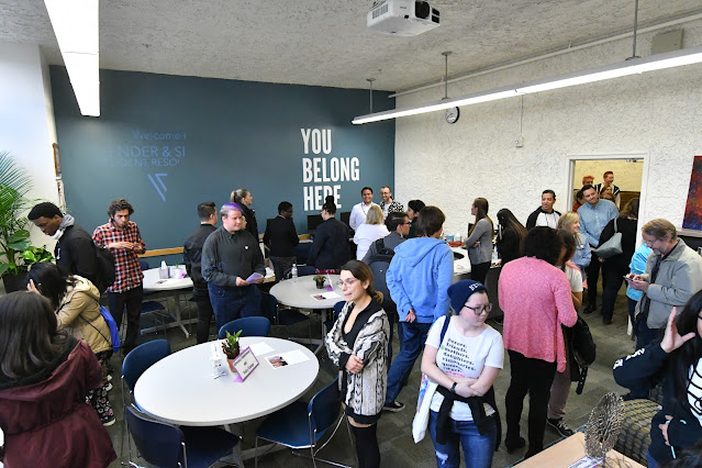 A crowd checks out the new Gender & Sexuality Student Resource Center.